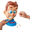 A close-up shot of a toy face with pimples being squeezed by hands. Podgląd zdjęcia produktu