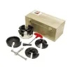 A set of woodturning chucks and accessories laid out on a white background, with a wooden storage box in the background. Produktbild-Vorschau