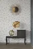 A wall with floral wallpaper, a decorative mirror, a vase with a golden leaf, and a small cabinet on a console table. Produktbild-Vorschau