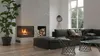 A modern living room with a fireplace, sofa, and coffee tables. Produktbild-Vorschau