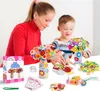 A woman and a child are crafting a DIY button flower bouquet. Produktbild-Vorschau