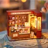 A miniature dollhouse dessert shop with detailed interior and exterior. Podgląd zdjęcia produktu