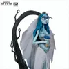 A statue of Emily from Corpse Bride, standing next to a dark, gnarled tree. Náhled obrázku produktu