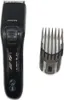 A black Philips hair clipper and a detachable comb attachment are shown against a white background. Náhled obrázku produktu