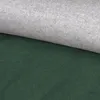 A close-up view of two pieces of fabric, one dark green and one light gray, folded over each other. Produktbild-Vorschau
