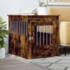 A wooden dog crate is placed next to a sofa, with a plant and books on top. Anteprima dell’immagine prodotto
