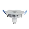 A white recessed spotlight with blue spring clips, shown against a white background. Náhled obrázku produktu