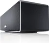 A black Canton Musicbox XS portable Bluetooth speaker is shown from a low angle on a white reflective surface. Produktbild-Vorschau