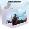 A mobile phone screen magnifier is shown with a video game displayed on it. The magnifier is white and has a large screen. Podgląd zdjęcia produktu