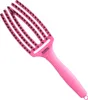 A pink hairbrush on a white background. Anteprima dell’immagine prodotto