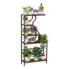 A multi-tiered plant stand filled with various potted plants, displayed against a white background. Voir les images du produit