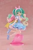 A figurine of Hatsune Miku in a fairy tale outfit, holding a treat, with a pink creature on her back, posed on a heart-shaped stand. Produktbild-Vorschau