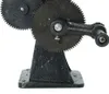 A close-up view of a mechanical device with gears and a crank. Podgląd zdjęcia produktu