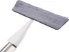 A spray mop with a gray microfiber cleaning pad attached to a white handle, isolated on a white background. Náhled obrázku produktu