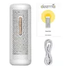 A product collage showing a dehumidifier, its manual, and a charging cable against a white background. Podgląd zdjęcia produktu