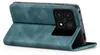 A teal flip case for a smartphone is shown in a diagonal side view, propped open to reveal the phone's camera array. Produktbild-Vorschau