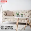 A living room scene with a sofa and two small tables. Anteprima dell’immagine prodotto