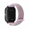 The back of a smartwatch with a fabric strap. Voir les images du produit