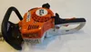 A Stihl hedge trimmer is shown on a white and light gray surface. Produktbild-Vorschau