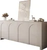 A light gray four-door sideboard with arched door fronts, decorated with various items on top. Produktbild-Vorschau