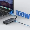 A USB-C hub is connected to a laptop, with a cable extending from the hub. The text '100W' is displayed prominently. Produktbild-Vorschau