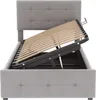 A grey upholstered bed frame with the mattress support slats lifted to reveal storage space underneath. Náhľad obrázku produktu