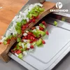 Chopped vegetables are being prepared on a bamboo cutting board with a stainless steel tray. Náhľad obrázku produktu