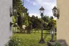 A collage of outdoor lighting fixtures displayed in a garden setting. Produktbild-Vorschau