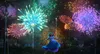 A young girl in a blue dress dances in front of a vibrant fireworks display over a village at night. Náhľad obrázku produktu