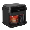 A black air fryer with muffins inside, shown from a front-side angle on a white background. Produktbild-Vorschau