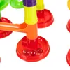 Close-up of a colorful marble run toy with marbles in a red base. Podgląd zdjęcia produktu