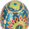 Close-up view of an ornate, egg-shaped decorative box with a peacock feather design. Produktbild-Vorschau