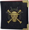 A black wallet with a gold skull and crossbones emblem and the words 'ONE PIECE' embossed on it. Produktbild-Vorschau