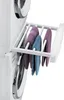 A white drying rack with towels attached, mounted on a stacked washing machine and dryer. Náhled obrázku produktu