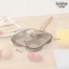 A multi-compartment frying pan with a glass lid, shown on a wooden surface with pancakes, eggs, and strawberries. Náhľad obrázku produktu