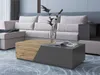 A modern living room scene featuring a sectional sofa and a coffee table. Náhled obrázku produktu