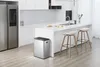 A modern kitchen with a stainless steel trash can and a refrigerator. Voir les images du produit