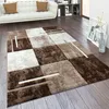 A modern living room with a white sofa, a bookshelf, and a patterned rug on a wooden floor. Voir les images du produit