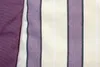 A close-up view of fabric with purple and cream stripes, next to a solid purple fabric. Produktbild-Vorschau