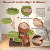 A multi-level cat tree with green leaf-shaped platforms and a brown tree-trunk-shaped hideaway, shown in a living room setting with a couch in the background. Anteprima dell’immagine prodotto