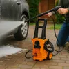 A person is using a pressure washer to clean a car. Podgląd zdjęcia produktu