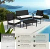 A rattan furniture set with white cushions is placed on a patio next to a swimming pool with a scenic view of the ocean and mountains in the background. Náhled obrázku produktu