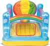 An inflatable bouncy castle with a rainbow theme. Voir les images du produit
