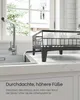 A black dish rack with white dishes is placed on a white countertop next to a kitchen sink with a faucet. Water is flowing from the faucet into the sink. Produktbild-Vorschau