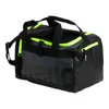 A black and gray duffel bag with neon green accents. Voir les images du produit