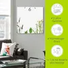 A square mirror clock with a floral design on a wall, next to a sofa and a window. A green sidebar contains product feature information. Produktbild-Vorschau