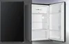 A black refrigerator with its door open, showing the interior. Produktbild-Vorschau