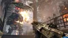A first-person perspective of a video game scene, showing a character holding a weapon, with a large robot and explosions in the background. Produktbild-Vorschau
