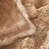 A close-up view of a soft, fluffy blanket with a textured surface. Náhled obrázku produktu
