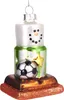 A glass Christmas ornament shaped like a snowman s'more with a soccer ball. Podgląd zdjęcia produktu